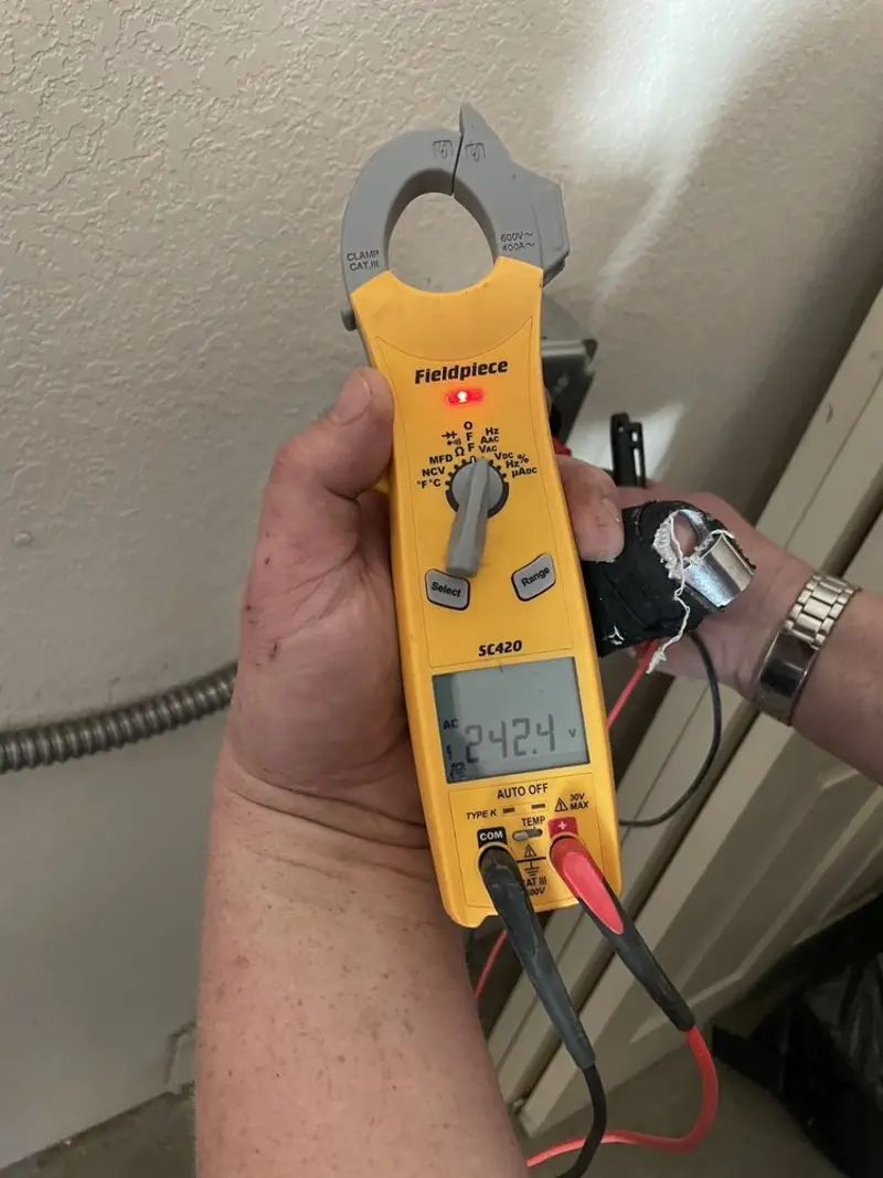 Voltage testing with clamp meter during Recessed Lighting Installation in Benton Harbor